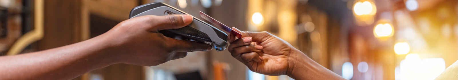 a person paying with a debit or credit card